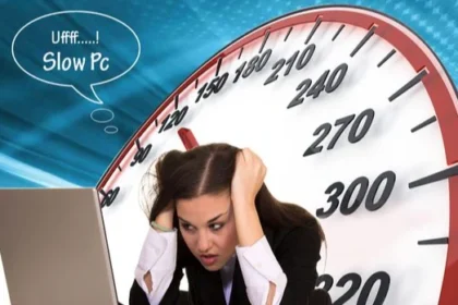 A person looking frustrated while using a slow computer, illustrating the need to fix performance issues