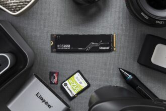 An internal NVMe SSD being installed into the motherboard of a computer, highlighting the process of a storage upgrade.