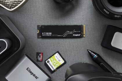 An internal NVMe SSD being installed into the motherboard of a computer, highlighting the process of a storage upgrade.