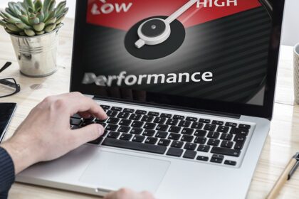 A professional working productively on a fast laptop in a bright, modern office, illustrating the positive results of improved computer performance
