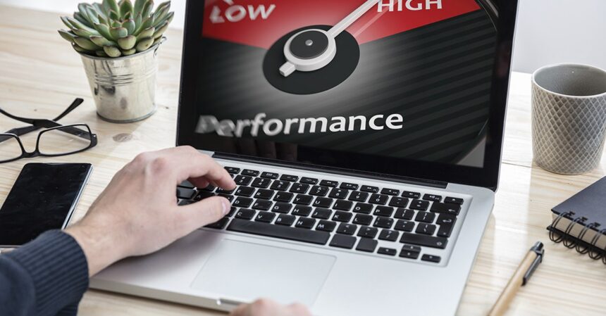A professional working productively on a fast laptop in a bright, modern office, illustrating the positive results of improved computer performance