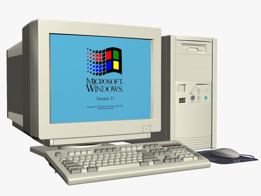 A large pile of electronic waste, including old computer monitors and keyboards, in a landfill, showing the environmental impact of improper disposal.